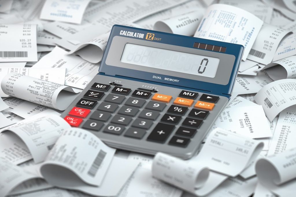 calculator on top of receipts