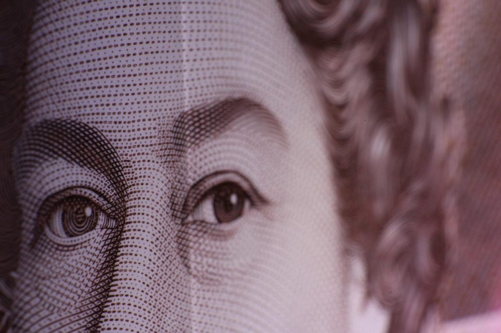 Close up shot of the late queens face on a bank note