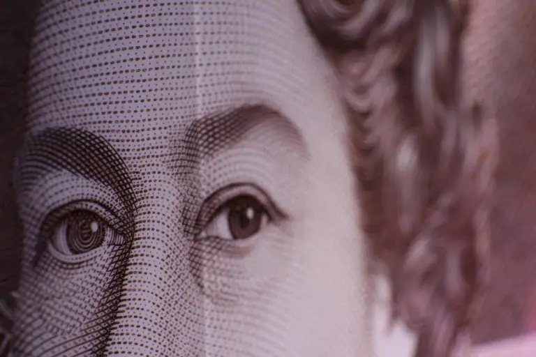 Close up shot of the late queens face on a bank note